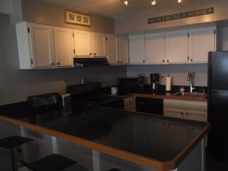 kitchen with counters stools
