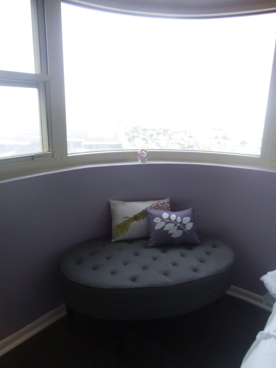 ottoman under bay bedroom window
