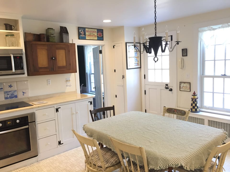 Modern kitchen with beautiful view out window and door to grilling area