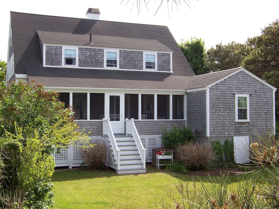 Rear screened porch with 1st floor bedroom to the right.