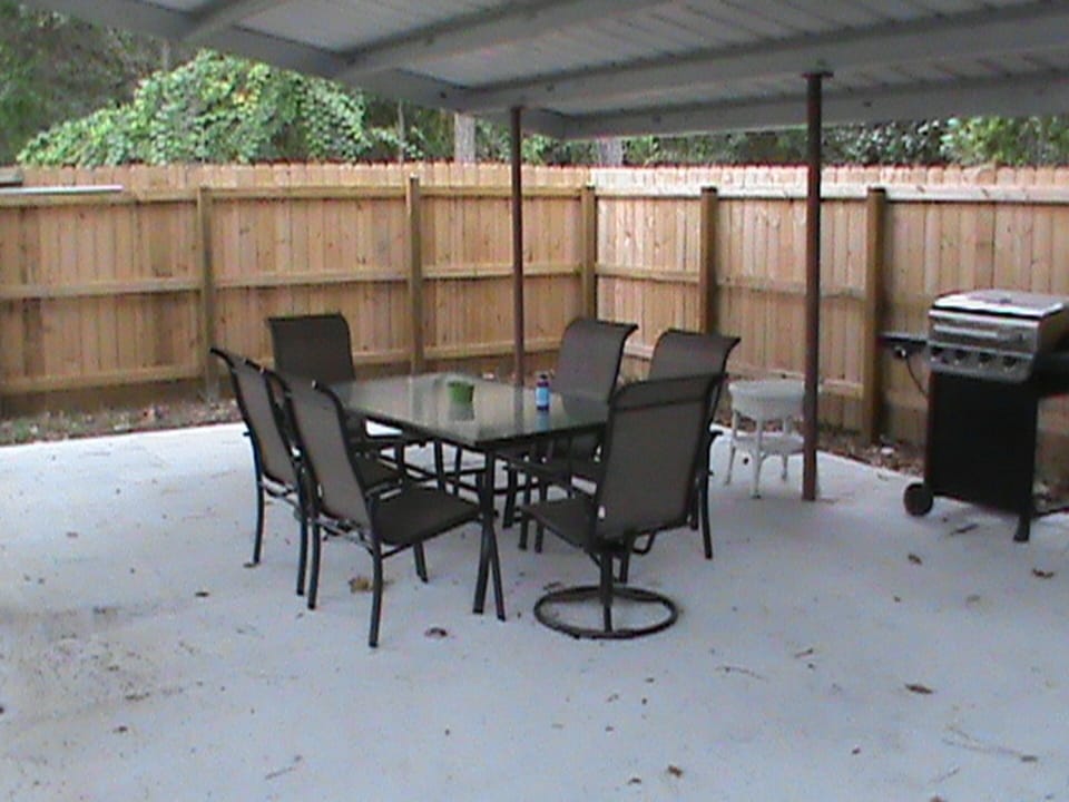 Outdoor Seating with metal cover with lighting, gas grill for use & charcoal pit