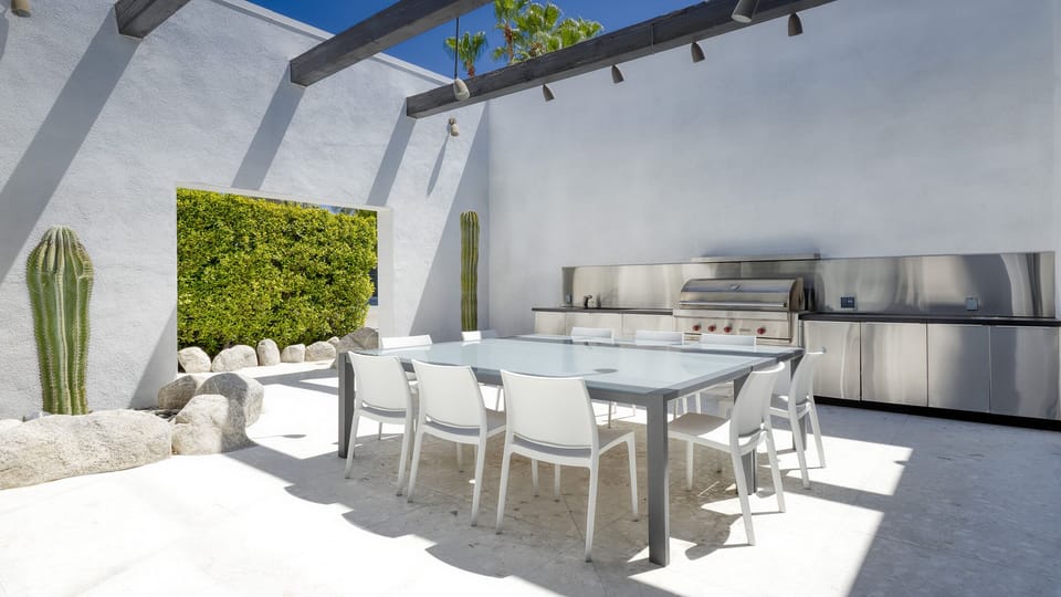 Enclosed outdoor dining for up to 16.  Viking gas grill and outdoor prep sink