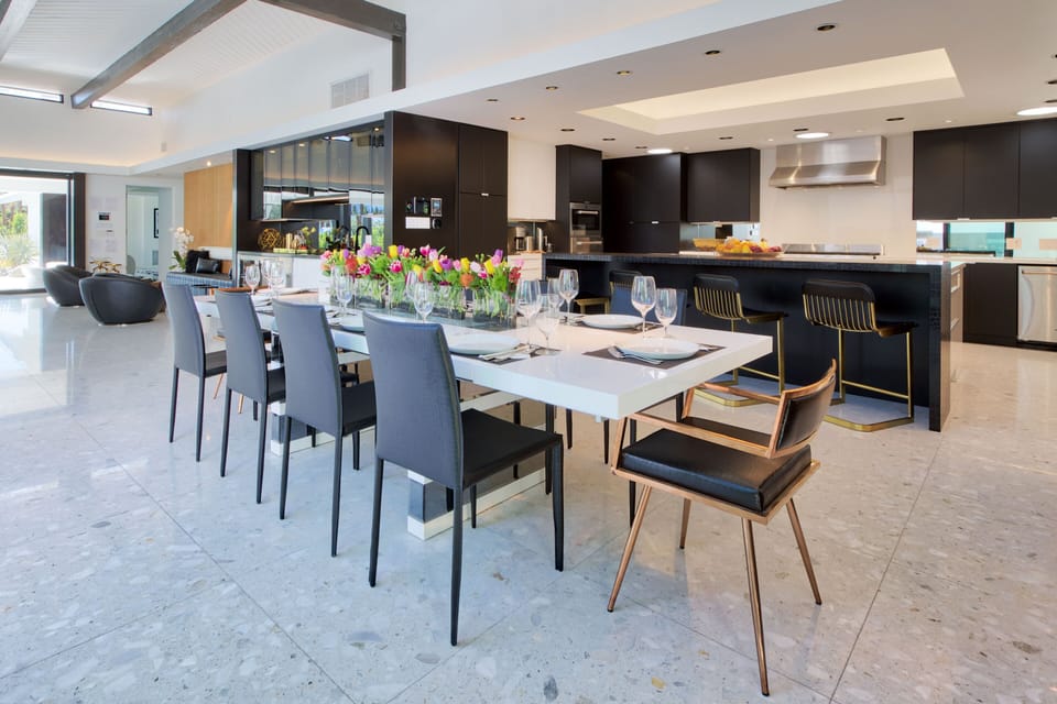 Dining with Kitchen and Lounge/Bar behind. Wine fridge, Bev center, Ice Maker