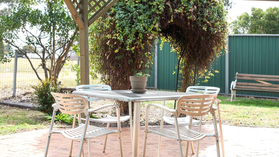 Spacious outdoor area with views over the park. BBQ & outdoor setting provided.