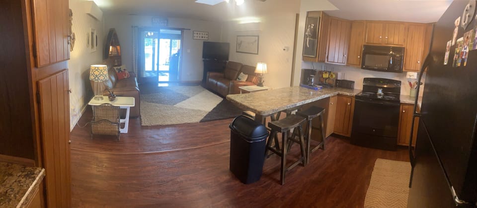 Living Room & Kitchen with gorgeous views out to the lake.