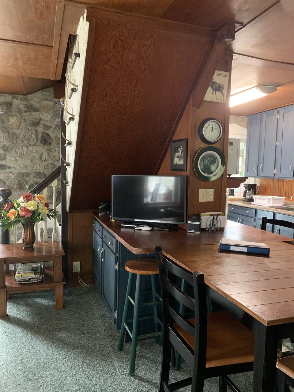 Cabinets with TV and stereo under the stairs.
