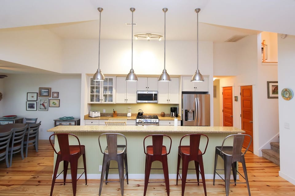 Dinning Room - Kitchen Bar - Entrance to King Bedrooms and Upstairs