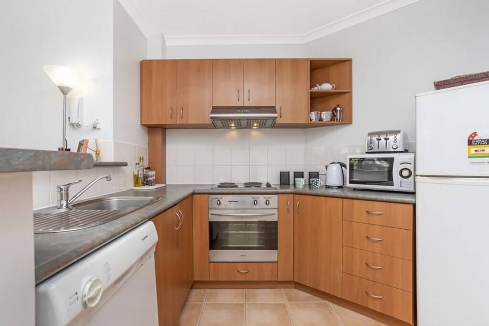Fully equipped kitchen with modern appliances cook and dine in comfort.