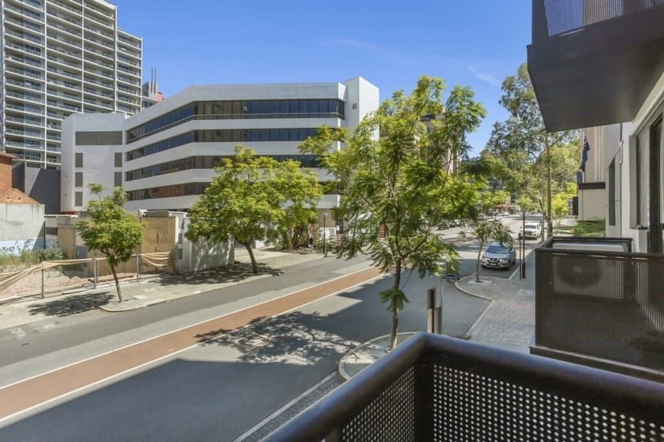 Enjoy a private balcony with peaceful street views, perfect for your morning coffee or evening unwind.