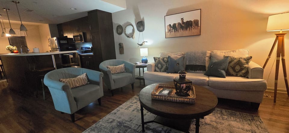 The living room has a full sized pull out sofa with a 5" memory foam mattress.