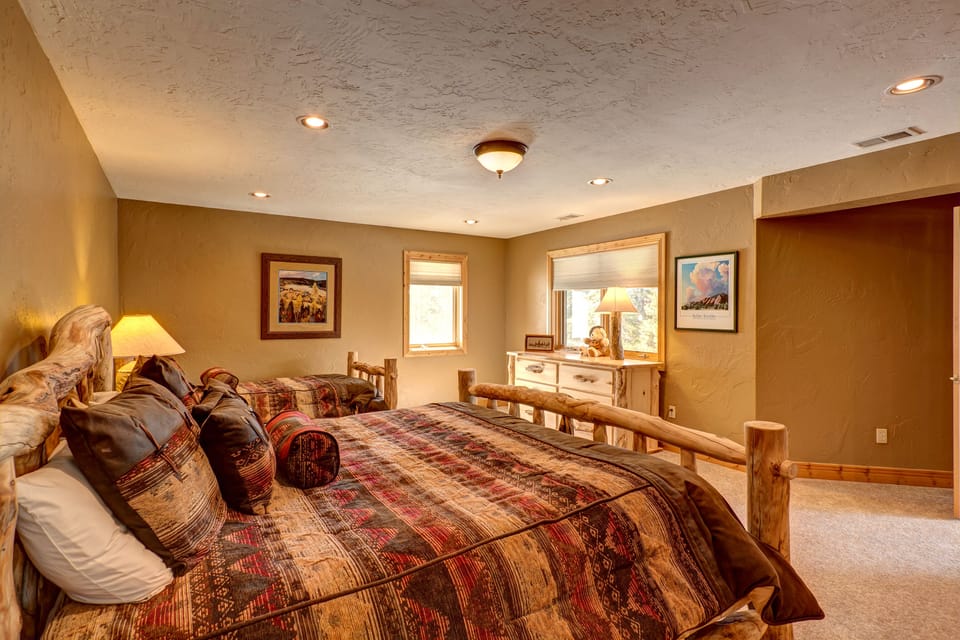 Downstairs guest bedroom with king and twin bed.