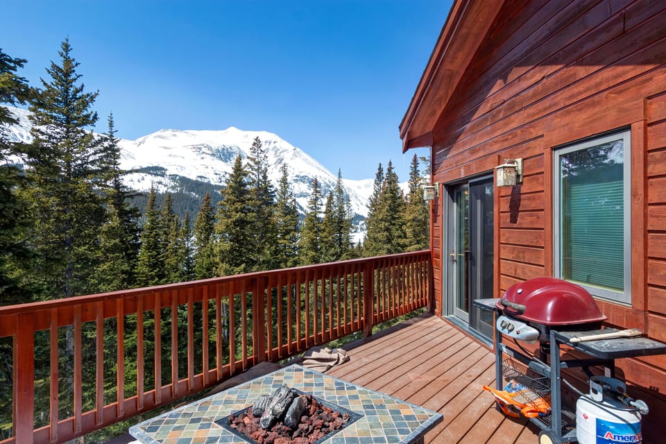 Outdoor deck with gas bbq grill and fire pit.