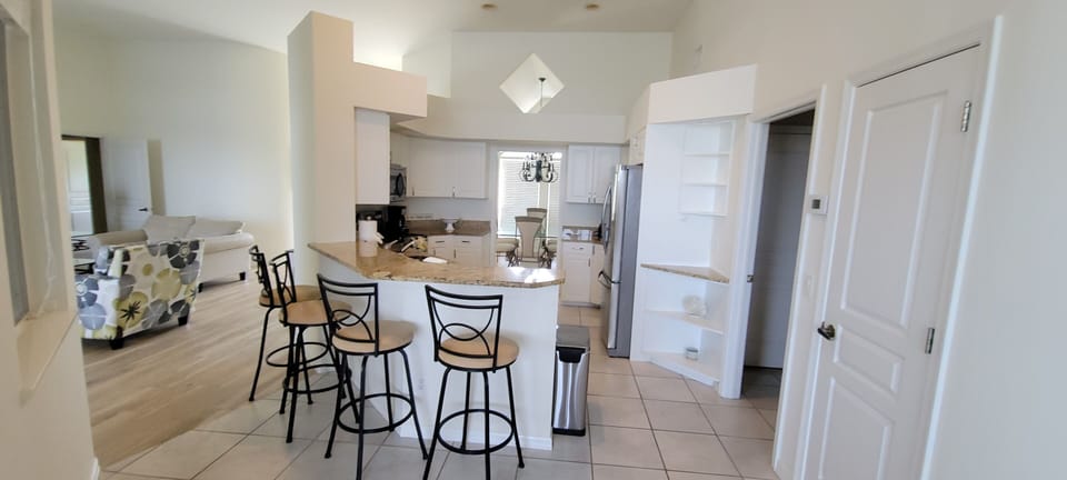 Fully equipped kitchen with bar seating
