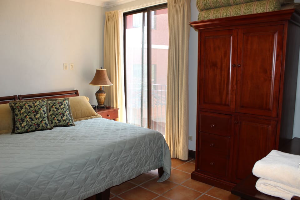 3rd bedroom (with king-sized bed set up) enjoys a beautiful tropical view.