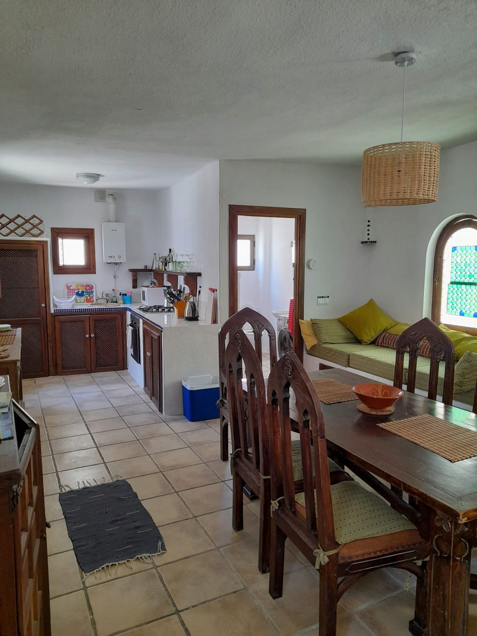 View from the dining room to the kitchen showing the downstairs bathroom.


