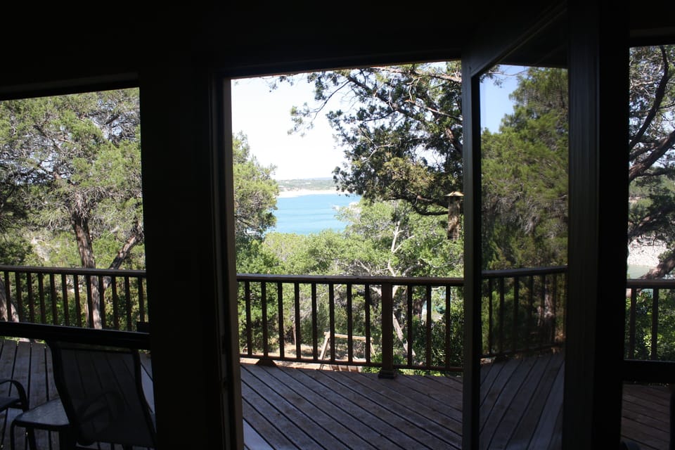 View of deck and lake from back door