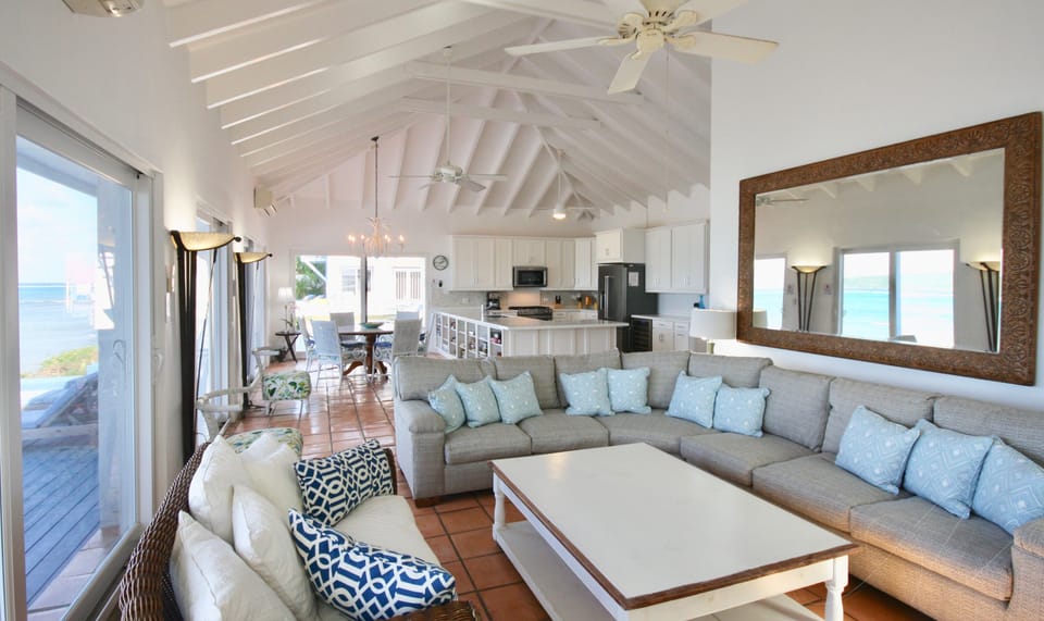 Comfortable and gracious decor with water views from inside out.