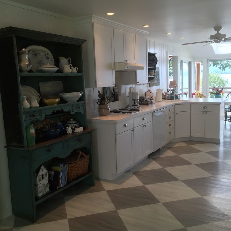 Newly renovated kitchen filled with interesting vintage finds. Lake views.