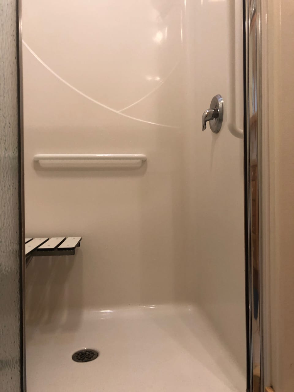 Full wheelchair accessibility with walk-in shower including fold-down seat.
