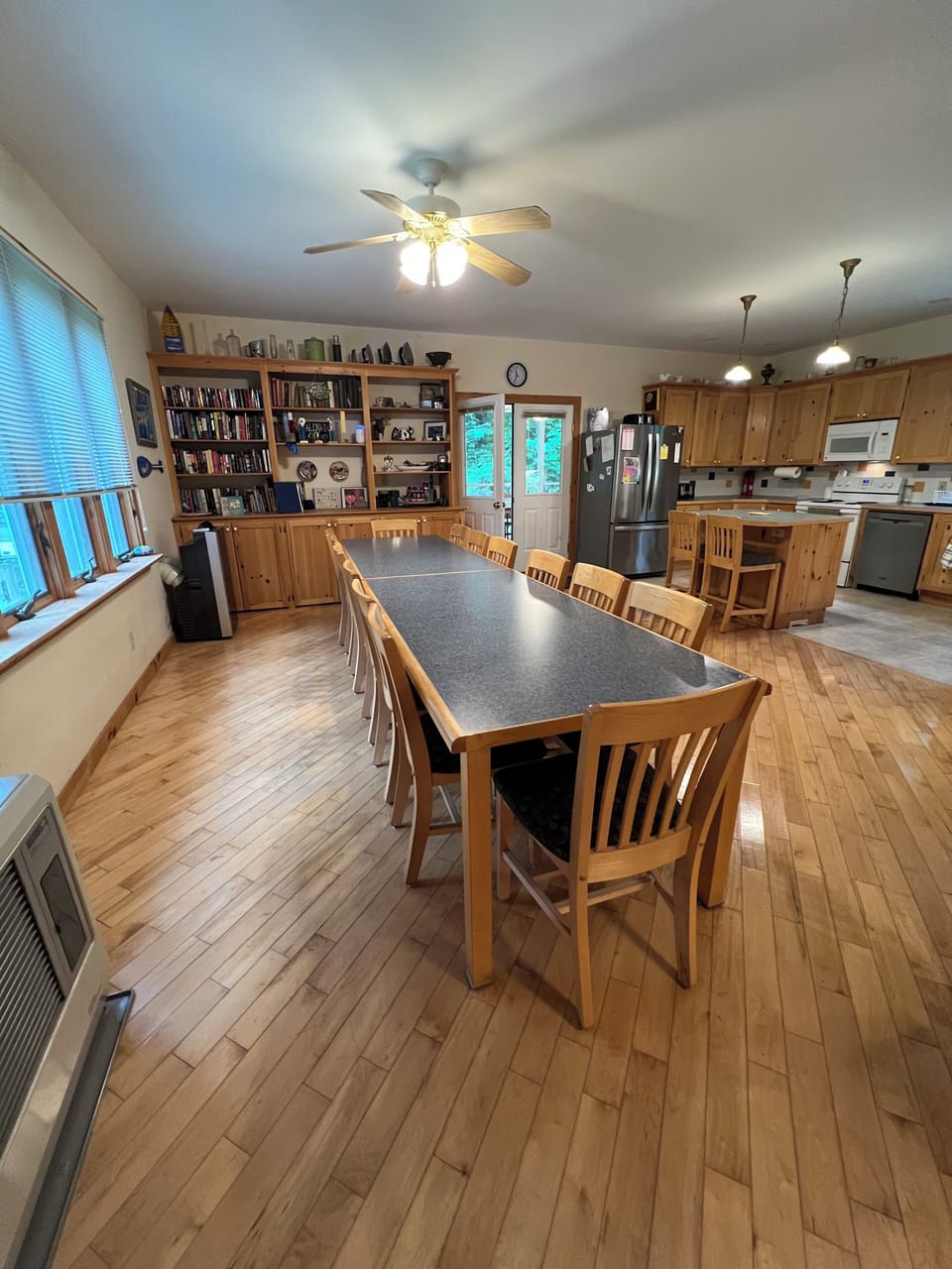 As our family expanded, so did the kitchen. Our new table (2019), seats 12-15.