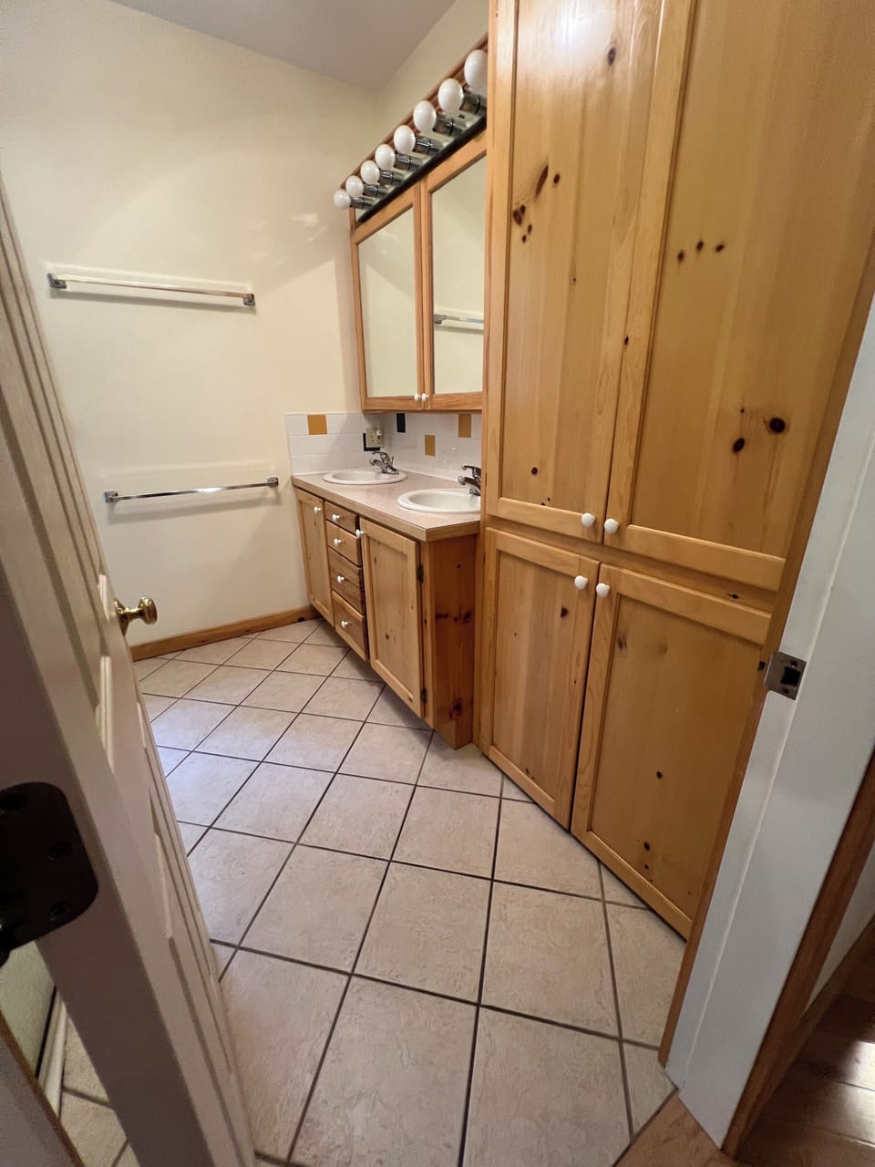 Main floor, full bathroom, double vanity, wheelchair accessible shower.