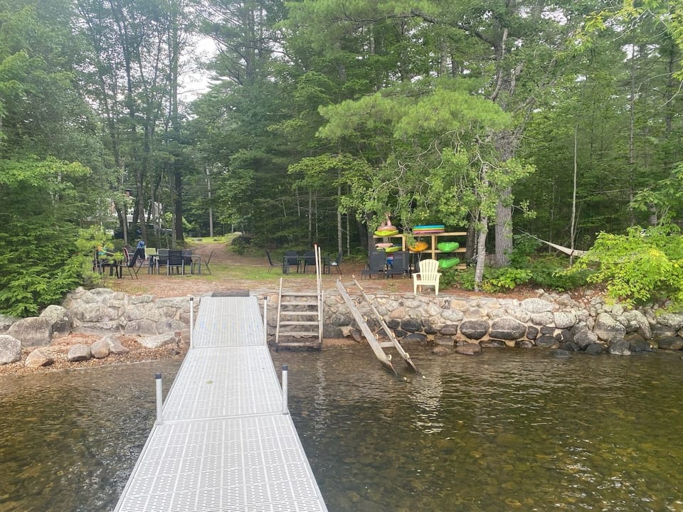 Walk across the street, find your oasis. Private lakefront with dock/raft.