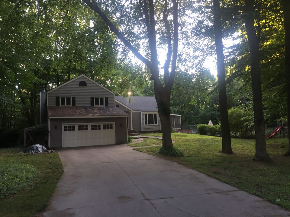Home on end of cul-du-sac on heavily wooded lot with deep ravine and creek.
