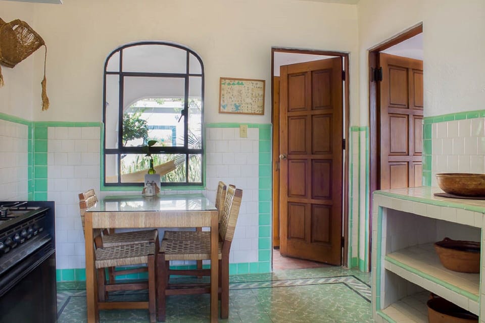 Kitchen with access to terrace and living/dining area. All appliances included.