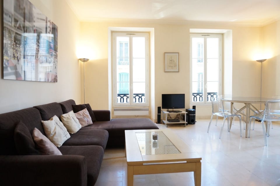 The living room showing the seating and dining area.