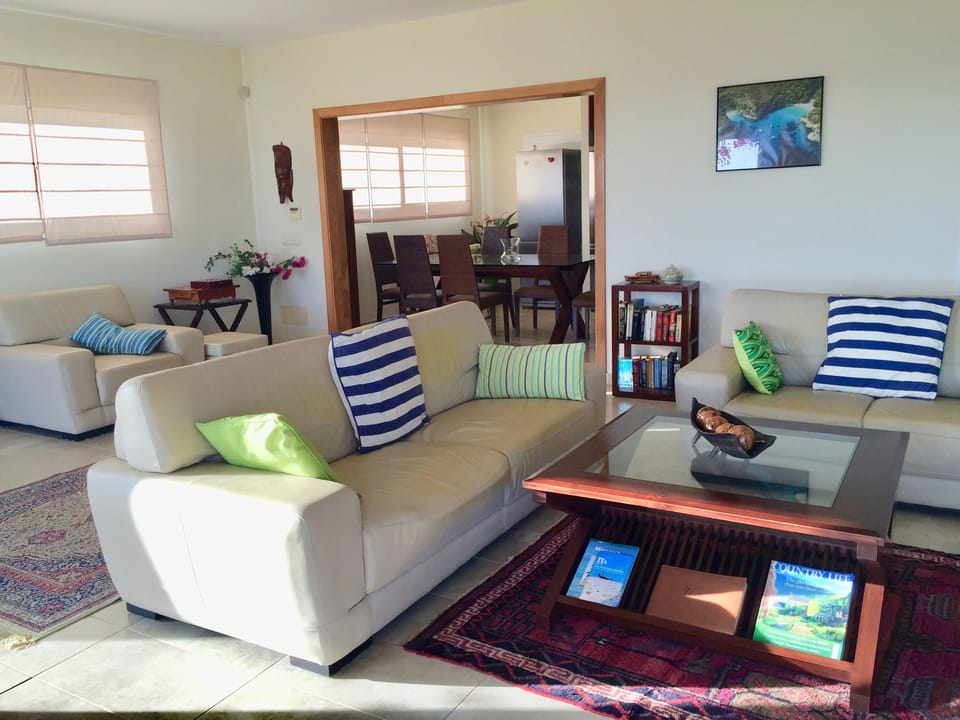 Lounge view through to open plan kitchen dining area.