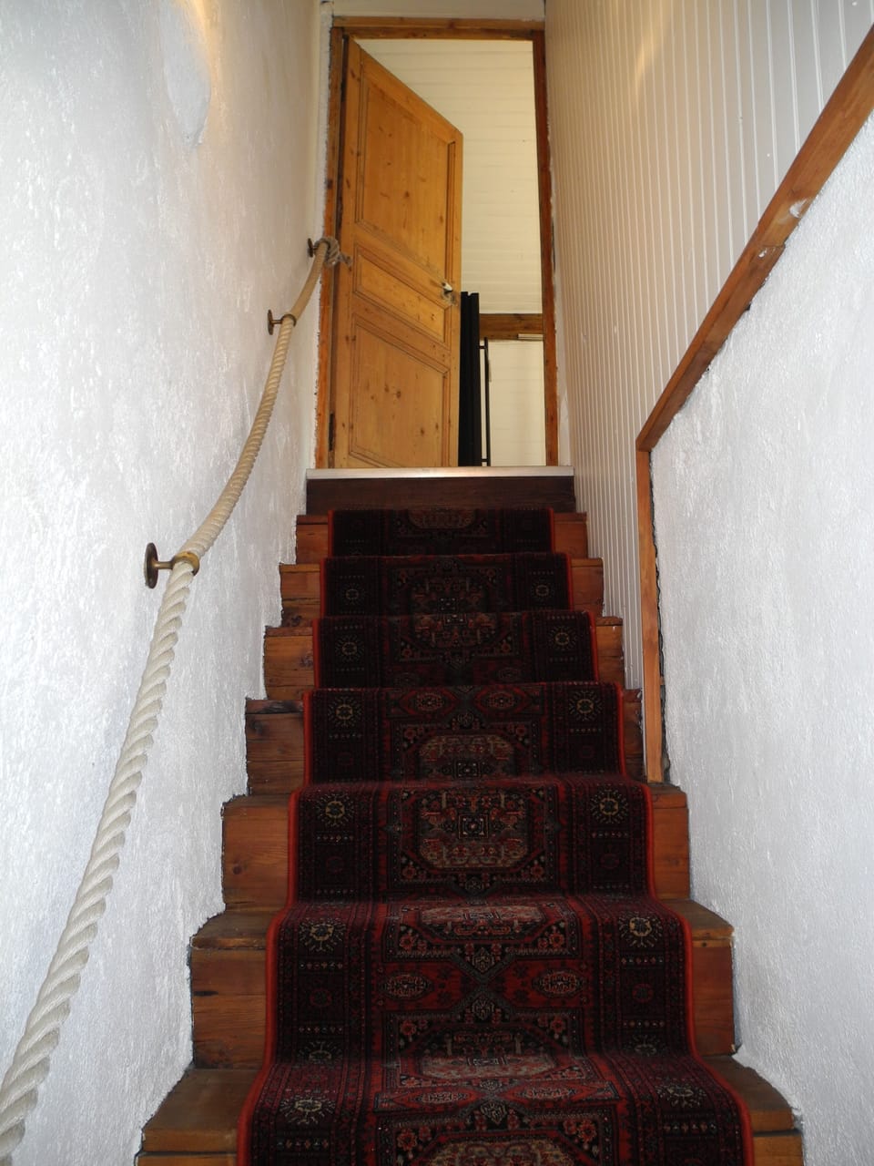 The stairs up to master bedroom