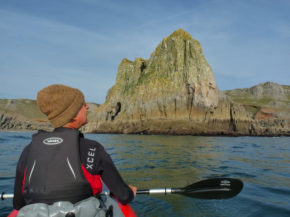 Kayaking below Paviland Cave