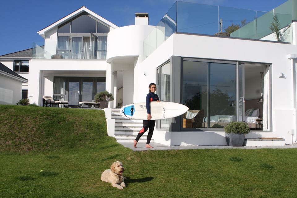 Back of house showing garden bedroom and dining terrace above with stunning view