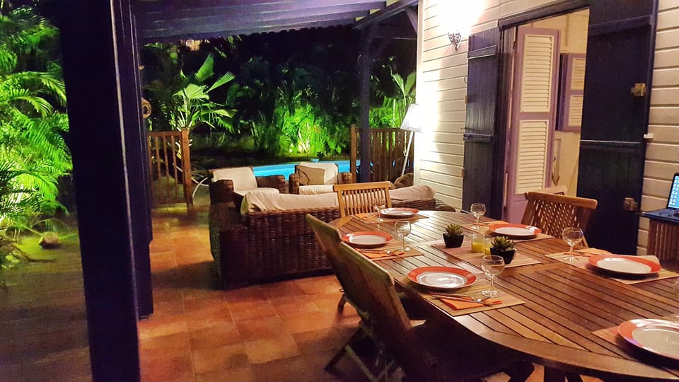 The sheltered terrace and living room of Villa Deshaies