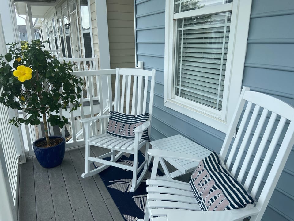 Covered front deck with rockers