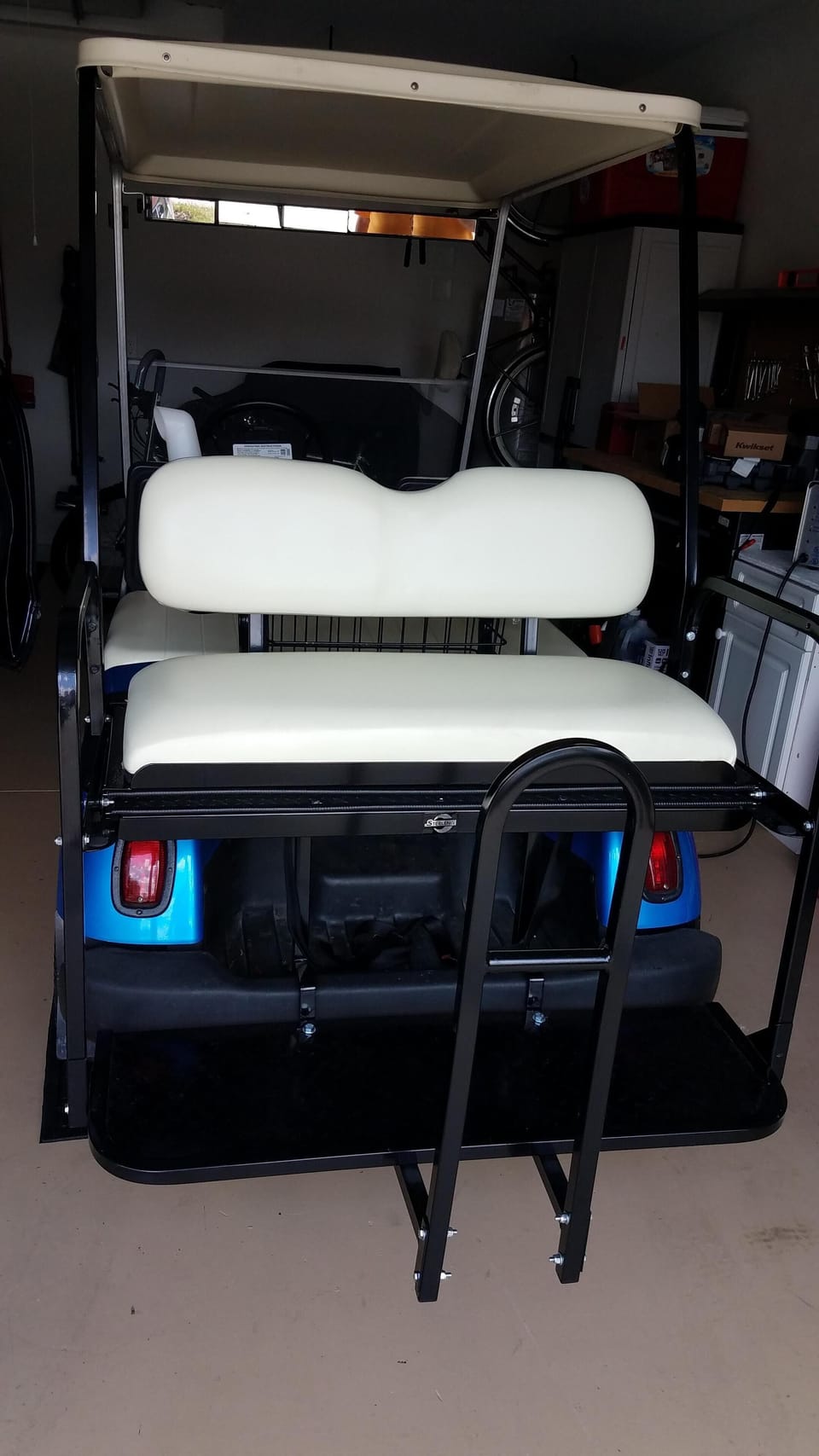 Golf cart.  Updated with a "speed kit" is included.  It can carry 4 adults.
