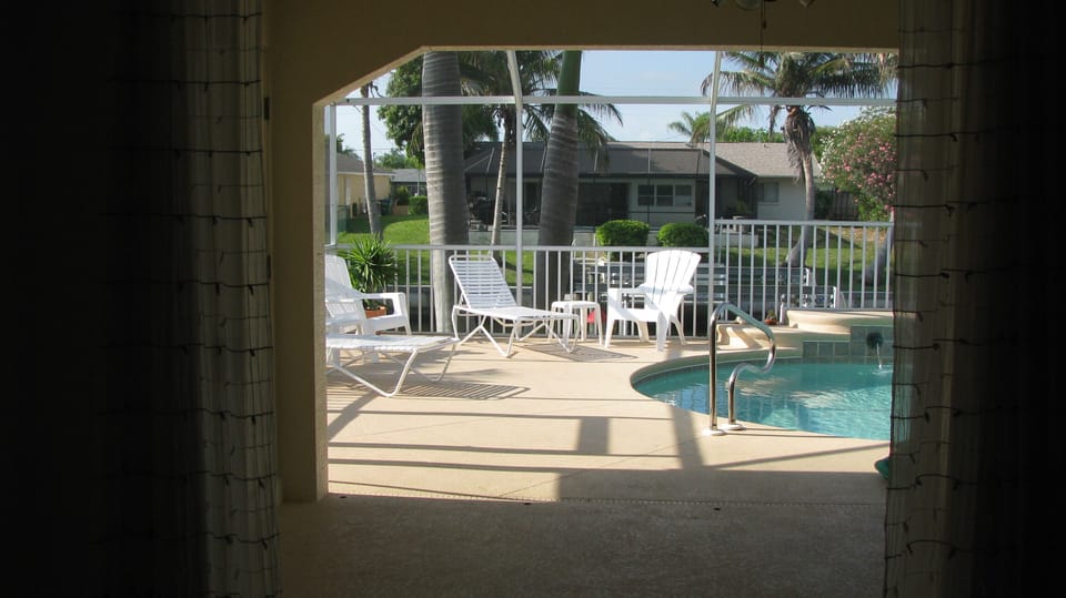 Pool and Lanai view from Master Suite.