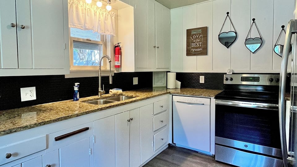 Kitchen with granite countertops and dishwasher