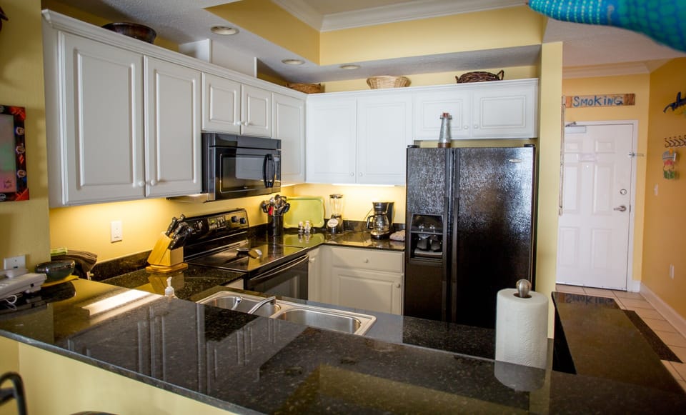 Kitchen with granite counters.