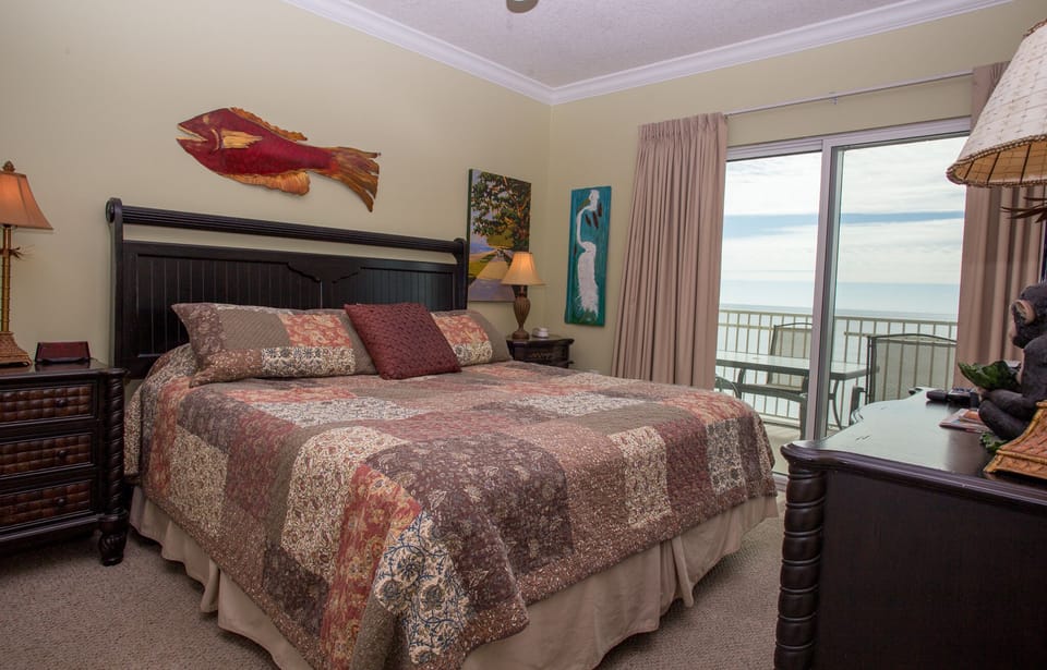 Master Bedroom King bed and private balcony access.