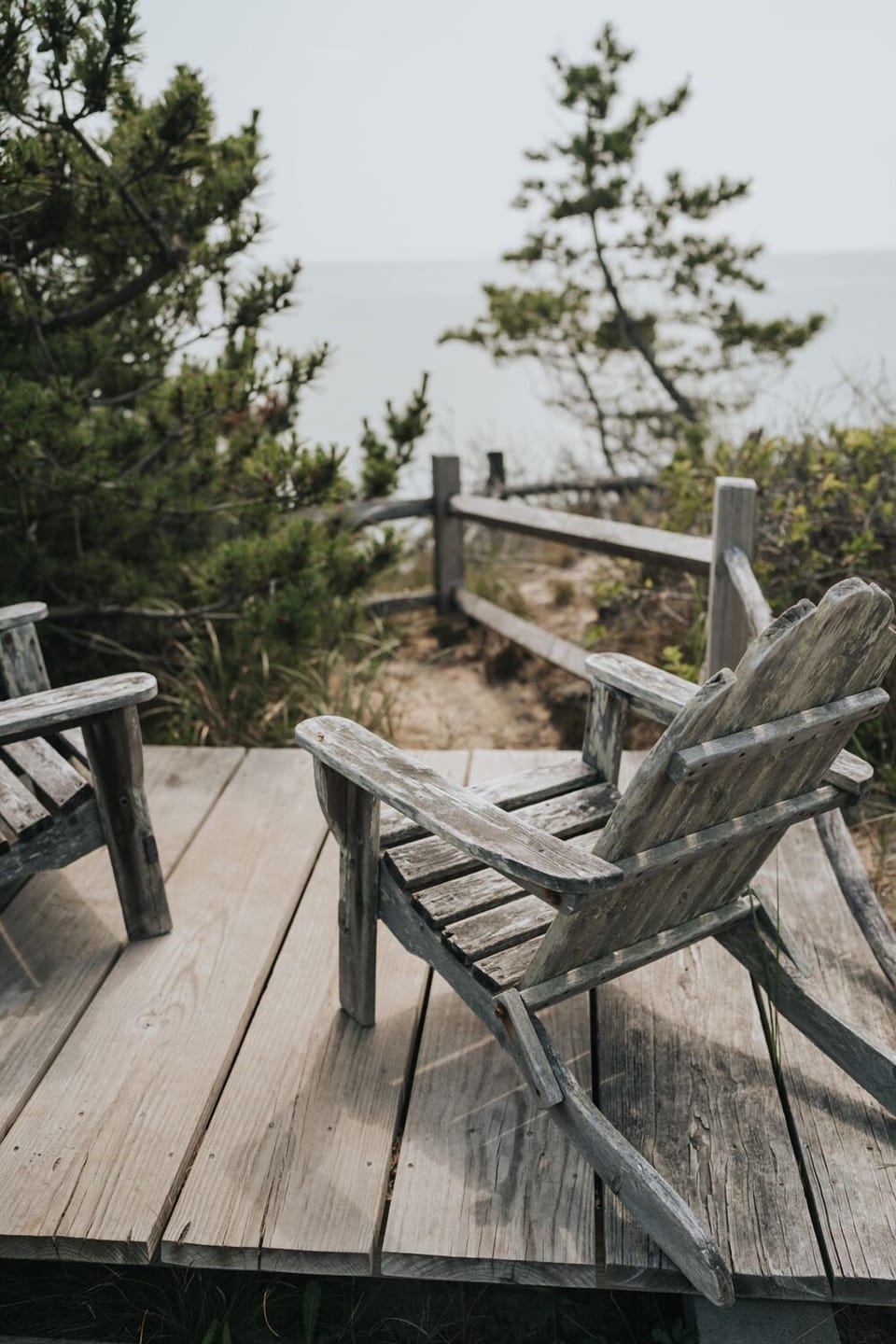 Chairs on top of the dune overlooking the bay
