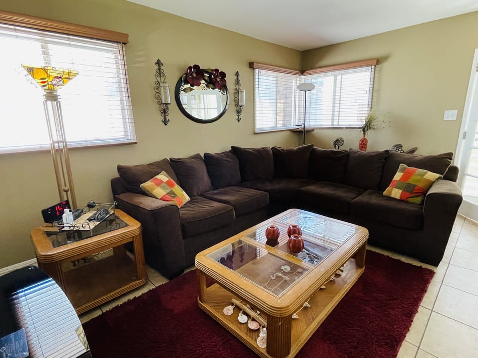 Big sectional in Living Room. Futon mattress also available