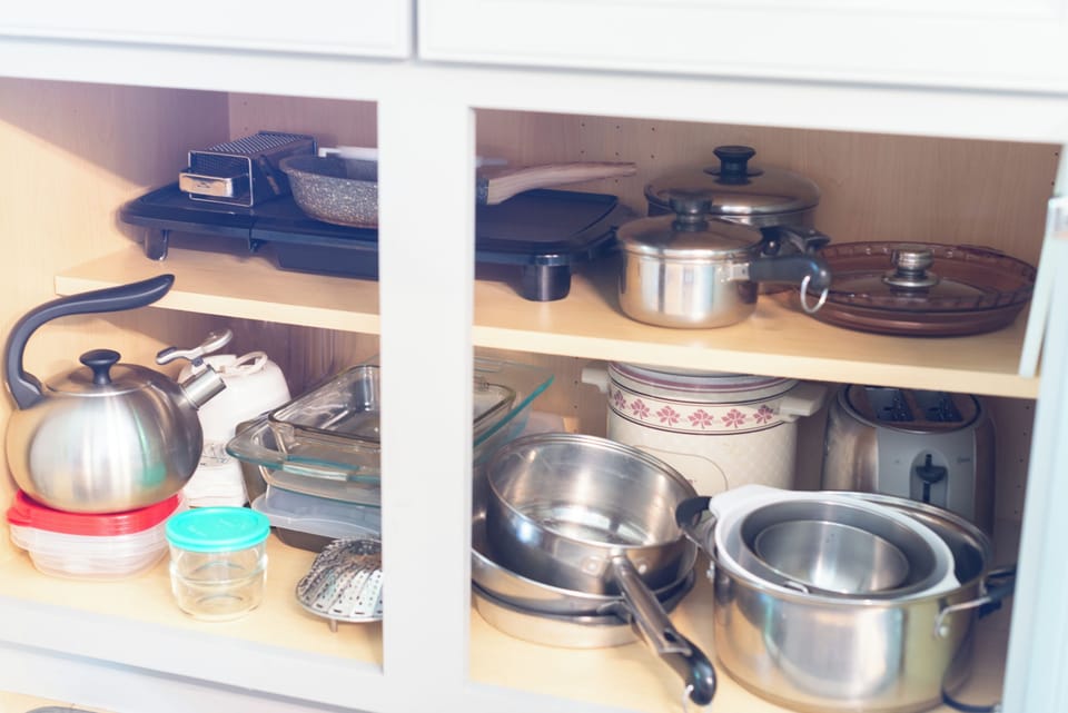 Fully-equipped kitchen with griddle, crockpot, mixer, toaster, well-maintained cookware