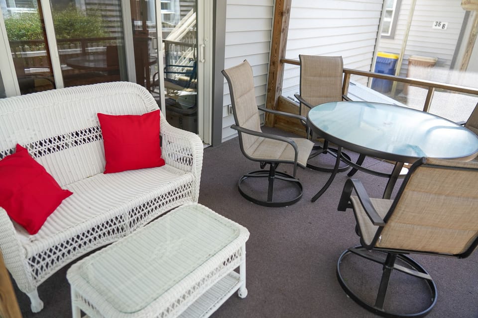 The screened-in patio offers conventient outdoor dining just off the kitchen