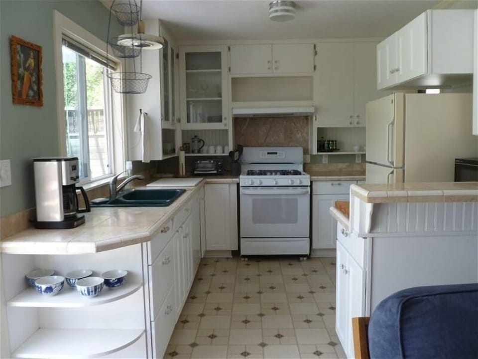Bright efficient kitchen with perhaps the best kitchen  sink view in town
