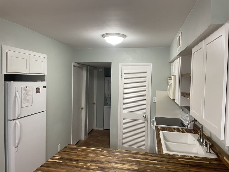 Kitchen includes refrigerator, stove/oven, dishwasher and microwave.