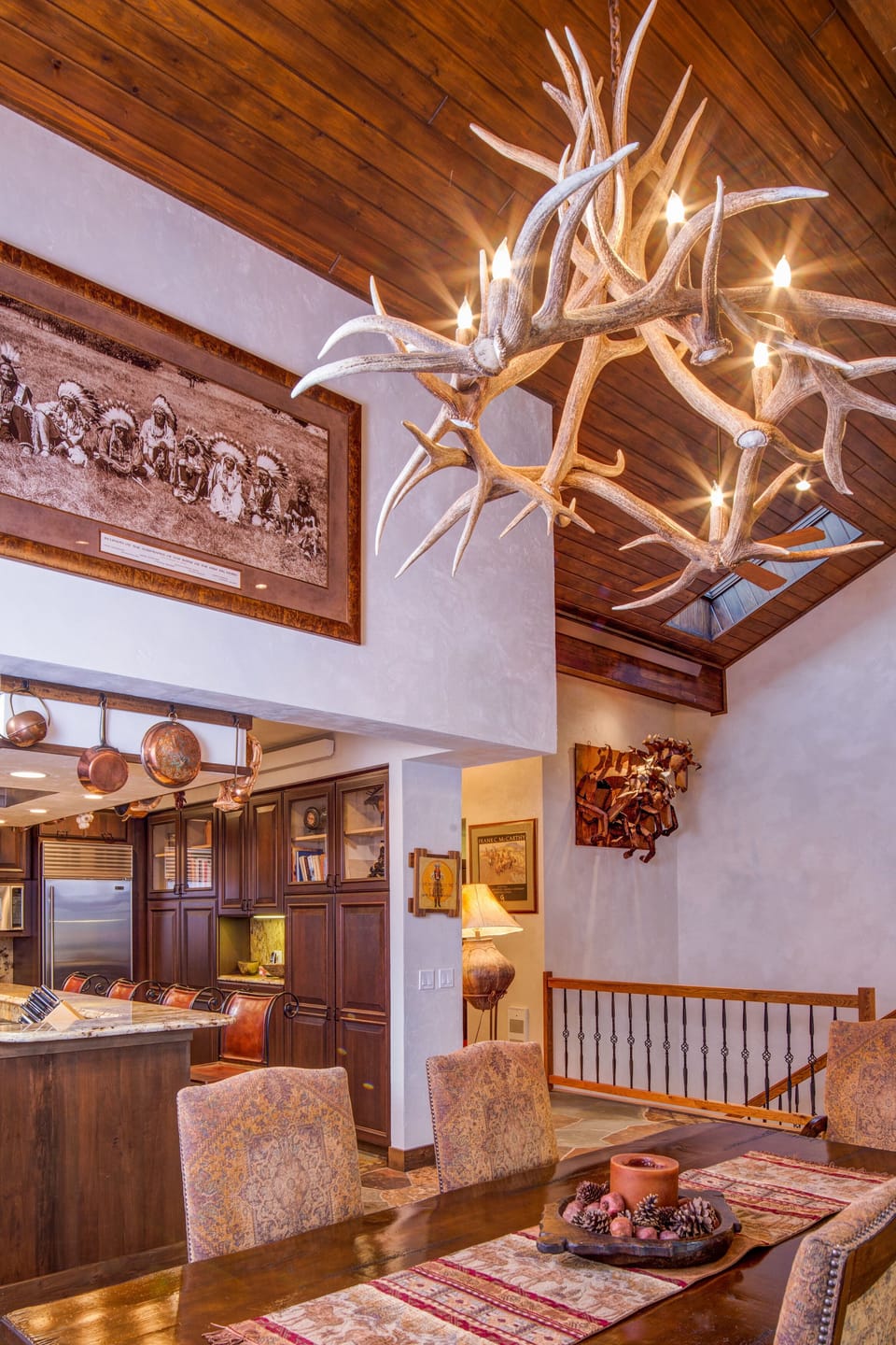 Dining room table comfortably seats 8 with room for overflow at the bar