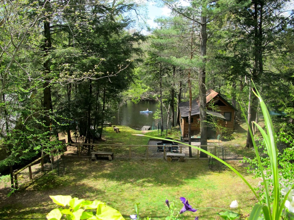 View of river and another cabin from the deck