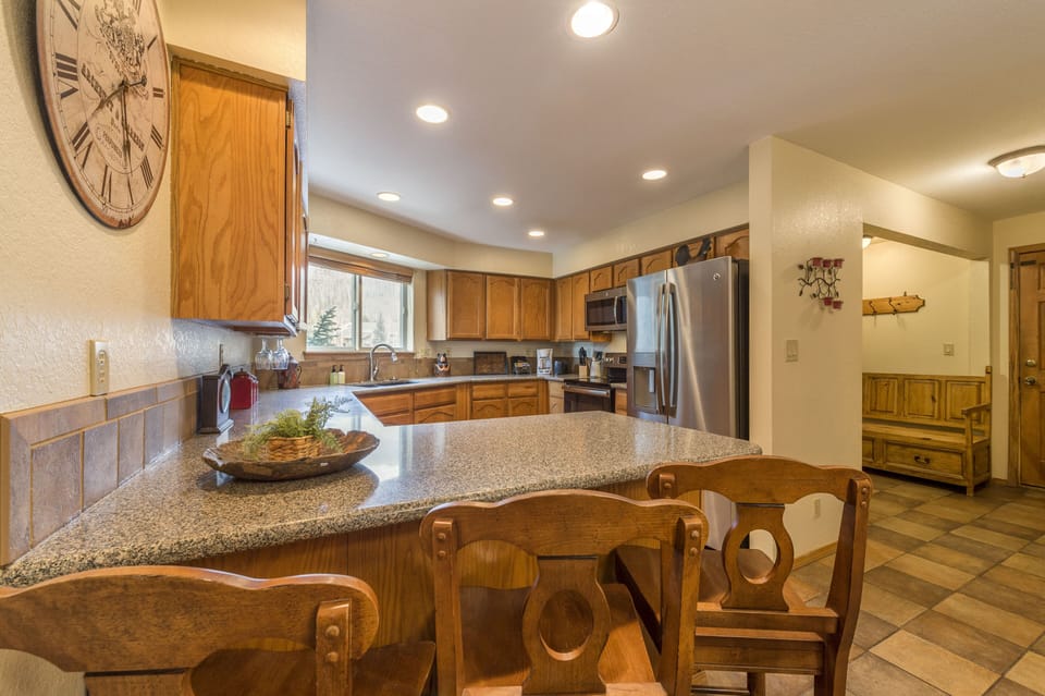 Large kitchen, including everything for cooking and for the dining table.