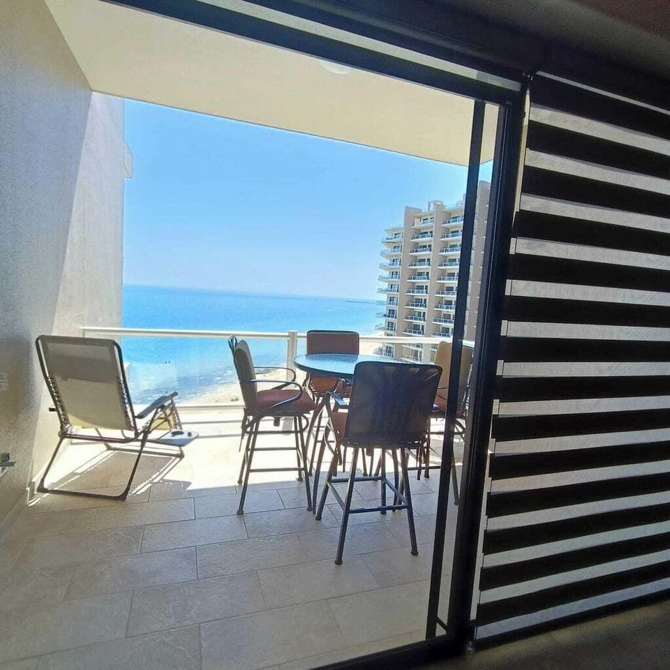 Balcony view while you're here.  2 anti-gravity chairs & table with 4 chairs.